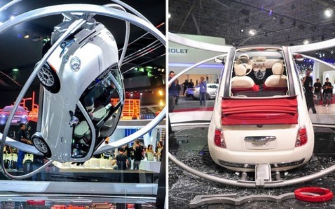 sa 3 SALÃO DO AUTOMÓVEL - AS 8 SITUAÇÕES MAIS ESTRANHAS DO EVENTO A estrutura giratória não aguentou e o Fiat 500 Cabrio caiu de bunda no chão. Como estava isolado, ninguém se feriu.