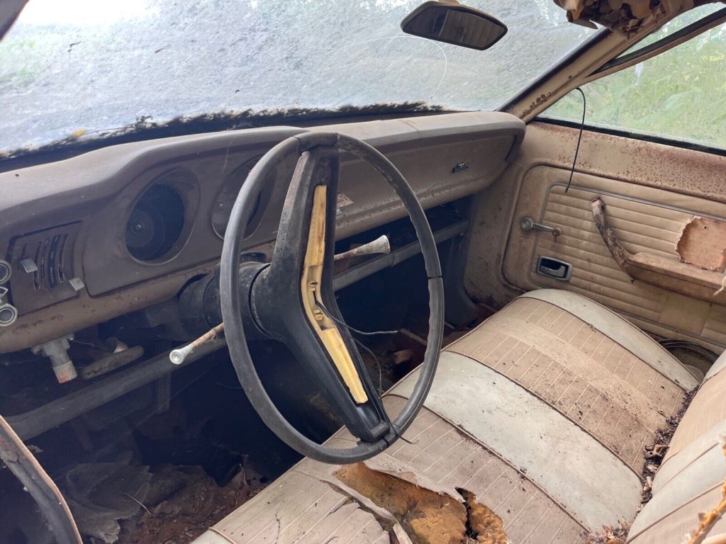 this 1973 ford was forgotten in a barn that fell apart now abandoned in the woods 13 1024x768 1